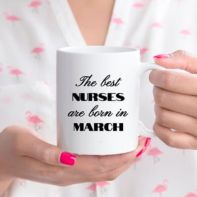 Nurses-March-Best Born In_11oz white mug nurse holding_Rt Handled_MG_7876-SQ CROP-800